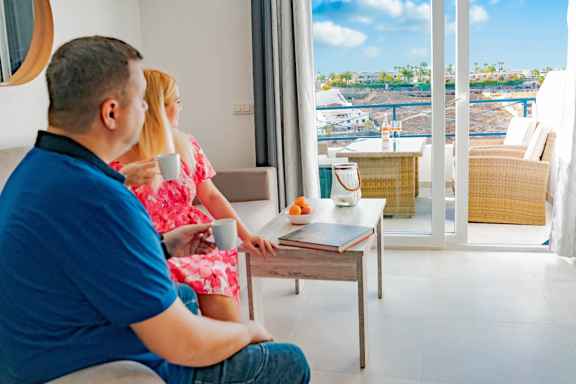 Veronika and Vašek in the apartment looking towards the terrace
