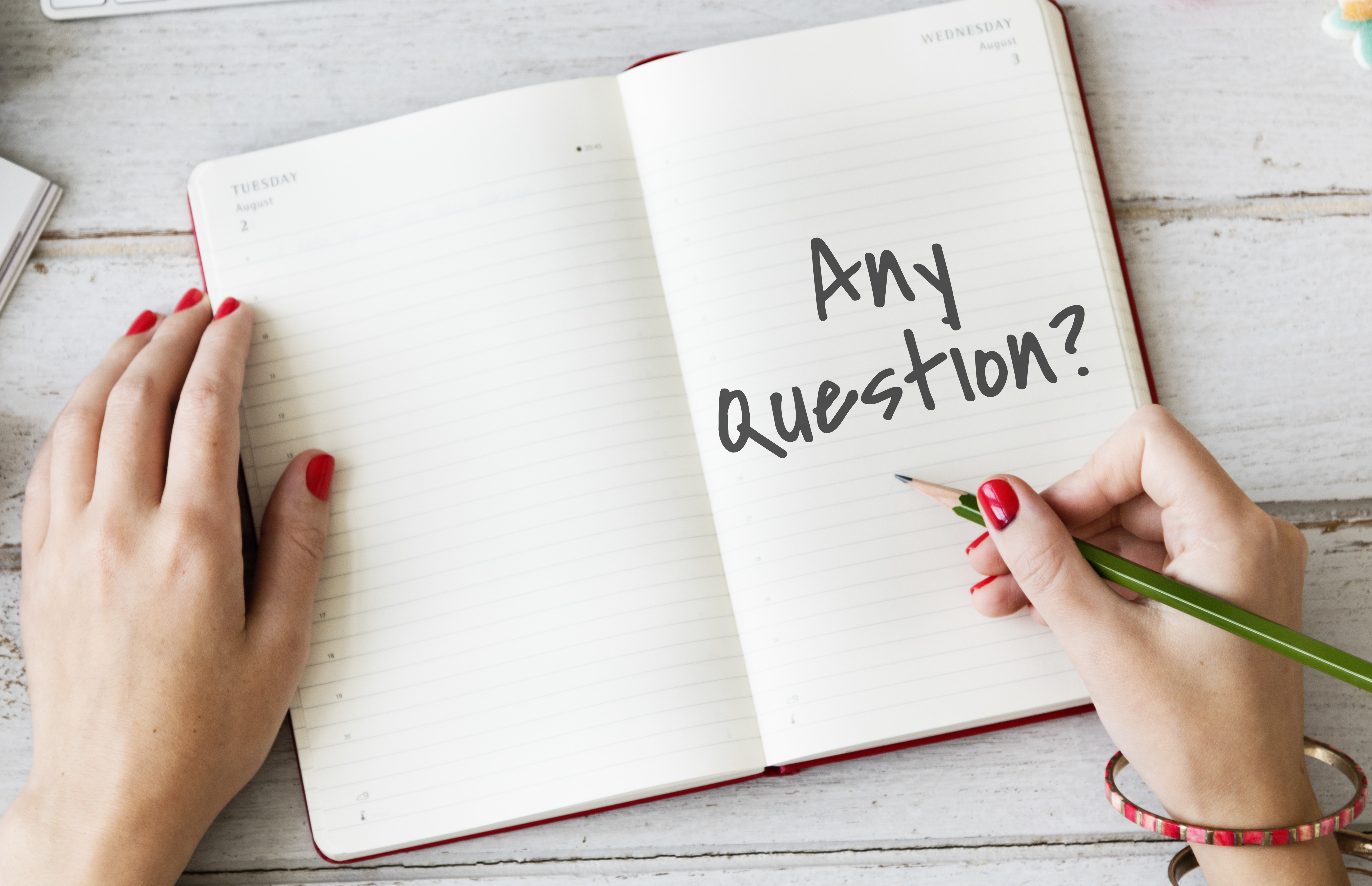 Open notebook with the words Any Question